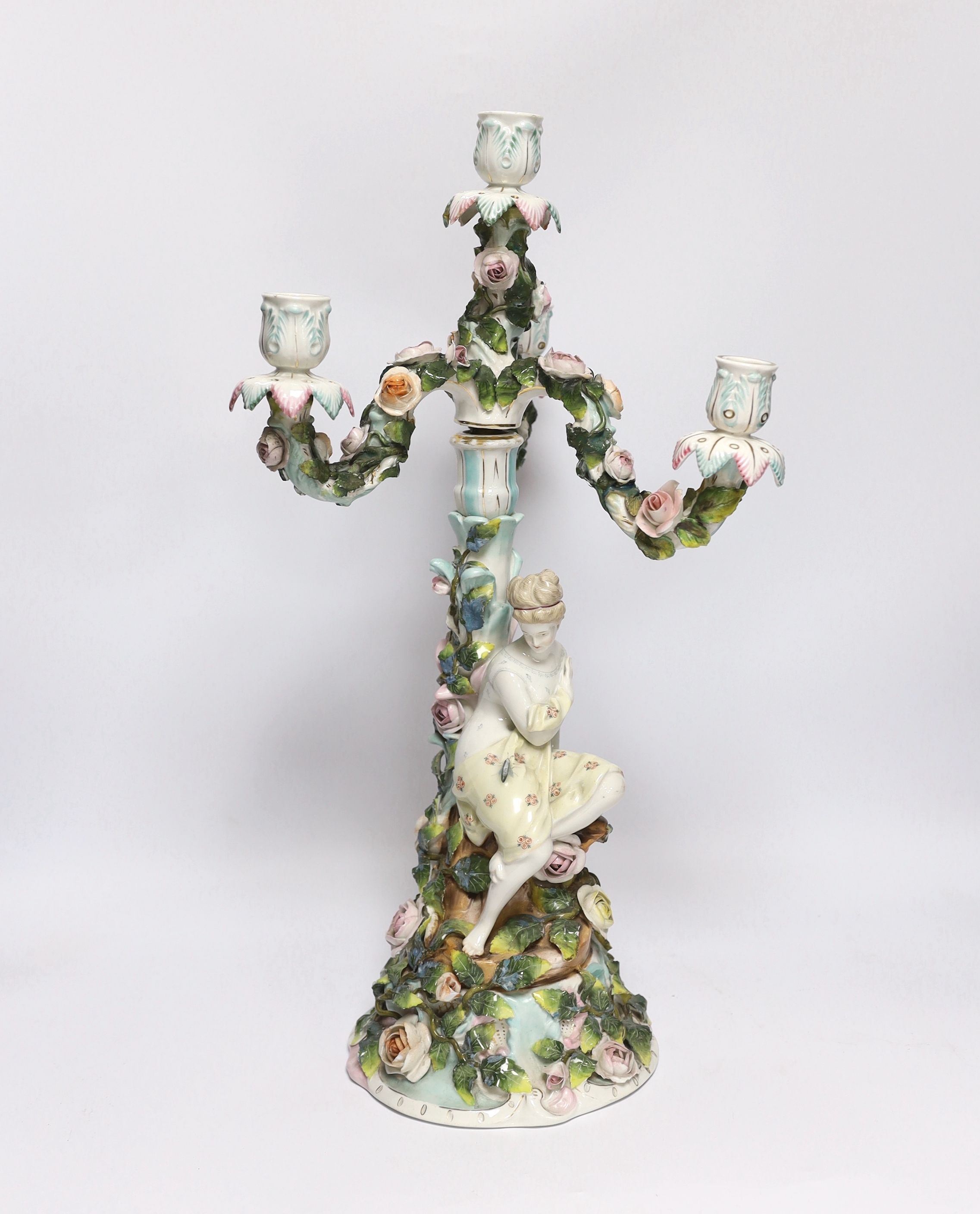 A 19th century Sitzendorf floral encrusted four light figural candelabra, 50cm